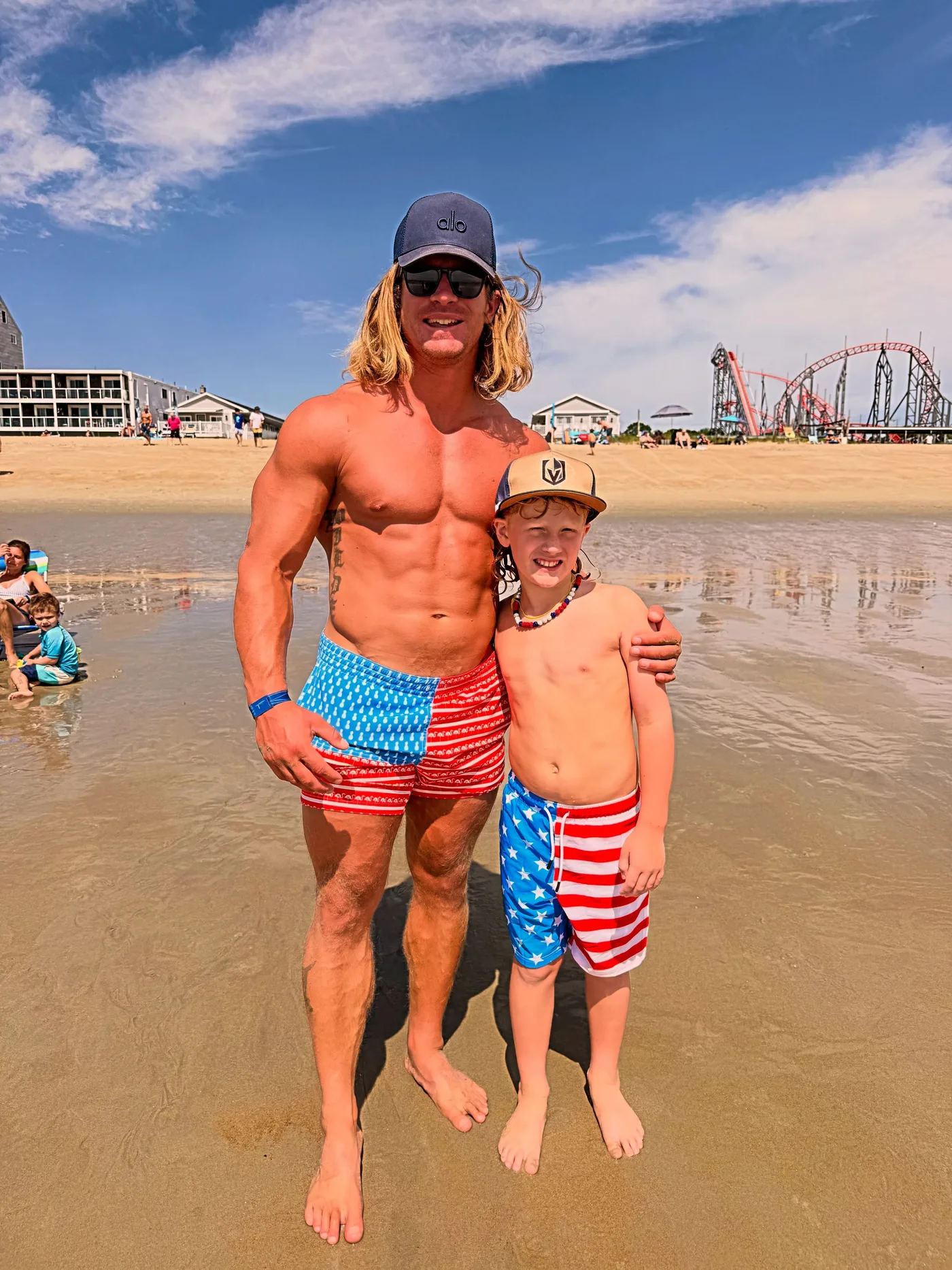Dan Wilde at the beach with his son